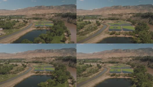 夏季无人机查看科罗拉多河流域农业绿地和水处理和BookCliff山脉4K视频系列高清在线视频素材下载