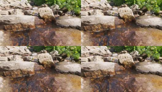 一股清冷的水流从石头上流过高清在线视频素材下载