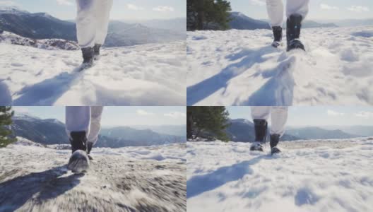 在冬季雪地上，徒步者走向相机。低角度的观点高清在线视频素材下载