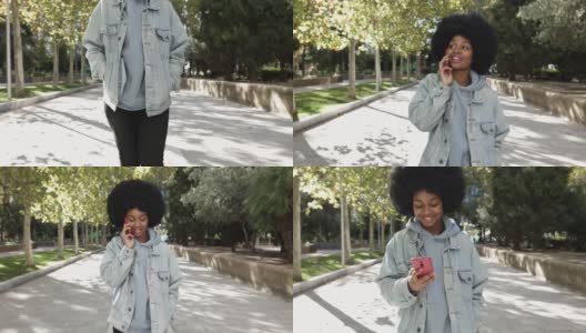 年轻女子一边在城市公园散步一边用智能手机聊天高清在线视频素材下载