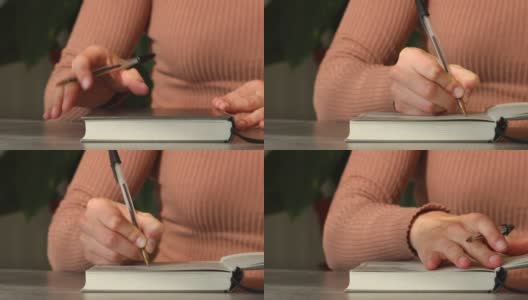 女人的手打开笔记本和书写高清在线视频素材下载