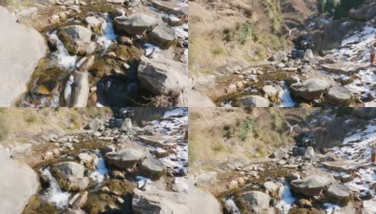 在喜马偕尔邦马纳里的约吉尼瀑布的路上，水流穿过岩石，印度高清在线视频素材下载