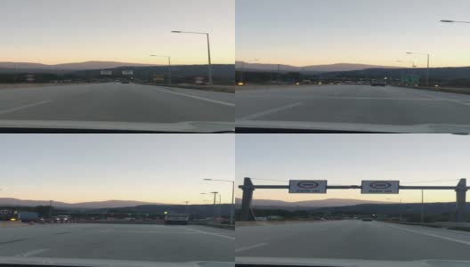 在夕阳的背景上去公路收费门山高清在线视频素材下载