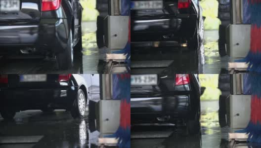 高清慢镜头:一辆车从后面穿过洗车场高清在线视频素材下载