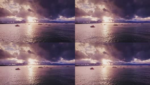 戏剧性的日落在太浩湖上的船-鸟瞰图高清在线视频素材下载