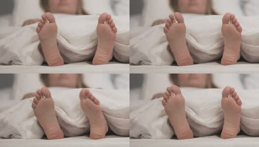 女士在床上脚痒不适，真菌皮肤病问题，医疗护理高清在线视频素材下载