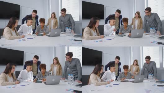 女老板向业务团队展示平板电脑上的数据高清在线视频素材下载