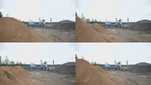 一个移动沥青工厂旁边的道路正在建设高清在线视频素材下载