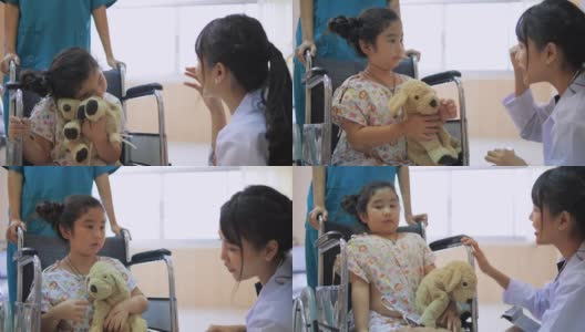 亚洲女医生检查小女孩坐在轮椅上与听诊器在医院，保健服务理念高清在线视频素材下载