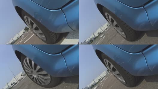 蓝色汽车在柏油马路上行驶，驾校实践课，考试高清在线视频素材下载