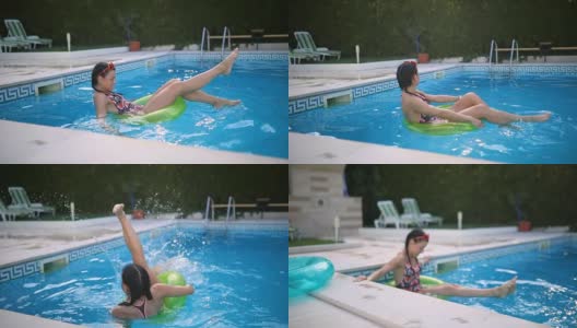 Smiling girl splashing water in the pool高清在线视频素材下载