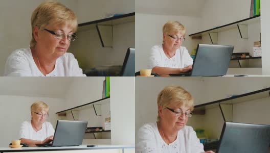祖母在用笔记本电脑工作高清在线视频素材下载