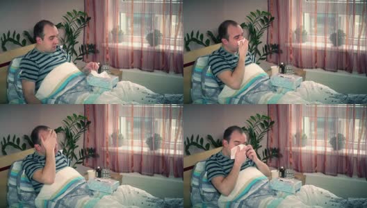 生病的男人躺在家里的床上擦鼻涕。季节过敏恶化高清在线视频素材下载