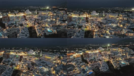 日落时分，希腊圣托里尼岛菲拉(Thira)镇的夜航高清在线视频素材下载