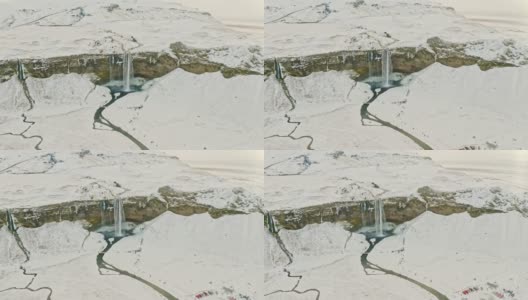冬季Seljalandsfoss瀑布的航拍视频高清在线视频素材下载