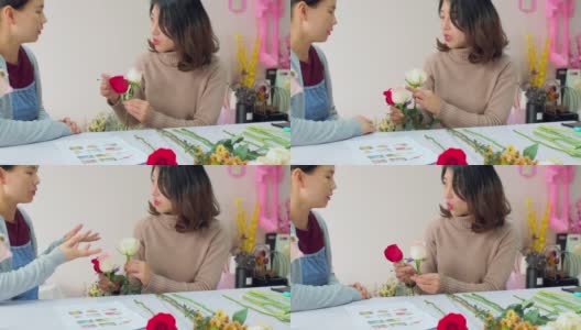 一位花商教她的朋友做花束，高清在线视频素材下载