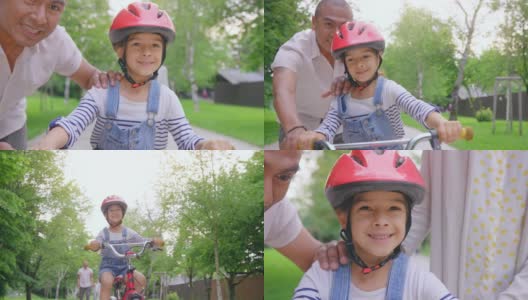 父亲放开了他的儿子，男孩独自骑着自行车沿街而行高清在线视频素材下载