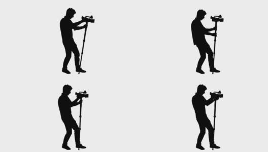 摄像师用单脚拍摄剪影高清在线视频素材下载