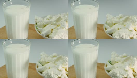 开胃的白干酪与牛奶在一个玻璃杯，新鲜的开菲尔工作室拍摄。酸奶。高清在线视频素材下载