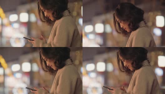 一个中国女孩在成都微笑着用手机高清在线视频素材下载