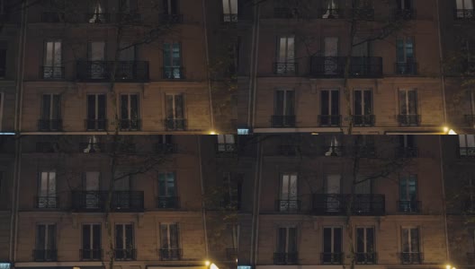 晚上的房子，有人在窗户旁，巴黎高清在线视频素材下载