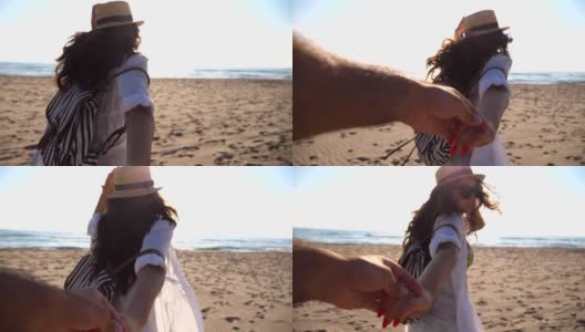 年轻的女孩牵着男人的手，在热带异国的海滩上奔向大海。跟着我拍的一个年轻女人拉着她的男朋友在海边。暑假或假日概念。观点慢动作高清在线视频素材下载
