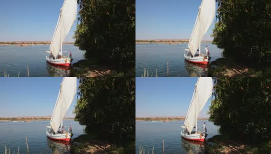 埃及阿斯旺附近尼罗河上的帆船。高清在线视频素材下载