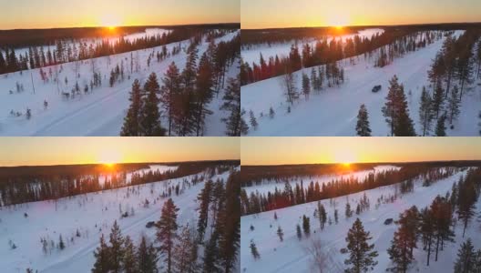 镜头:冬日金色的日出下，汽车行驶在雪地里的乡村道路上高清在线视频素材下载
