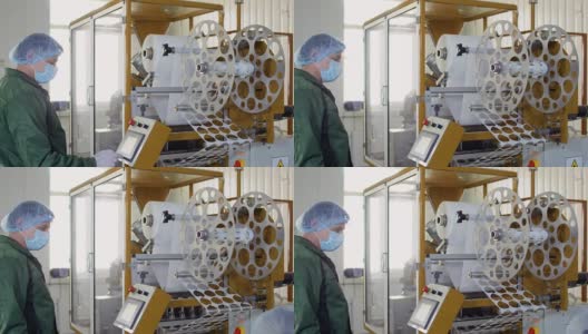 在茶厂工人控制工作机器的过程高清在线视频素材下载