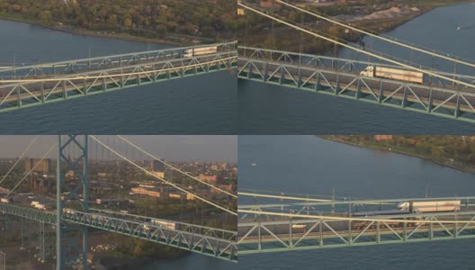 航拍:半卡车开过大桥进入底特律的物流中心高清在线视频素材下载