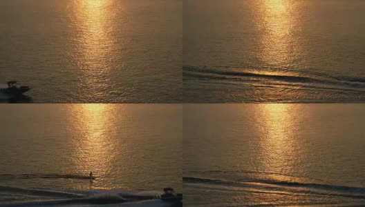 金色夕阳下的海面上滑水高清在线视频素材下载