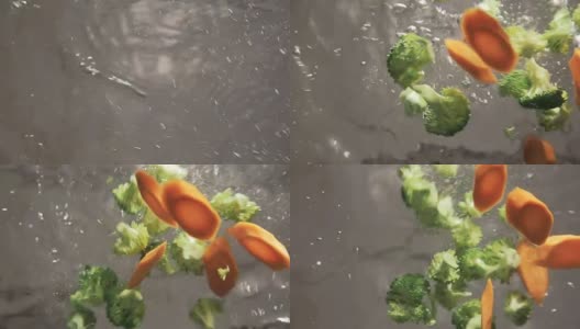 将西兰花和胡萝卜放入沸水中，动作缓慢高清在线视频素材下载
