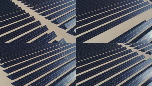 在沙漠中创造清洁可再生能源的大型太阳能农场上空的鸟瞰图高清在线视频素材下载