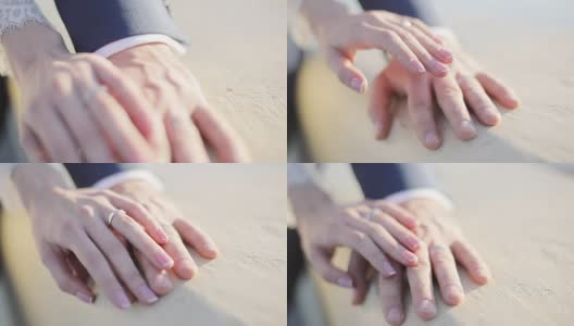 男女双手用结婚戒指拉近，握着互相抚摸，阳光的光线模糊了背景，景深浅。指甲油艺术家大师。新娘忠诚家庭联系统一理念高清在线视频素材下载