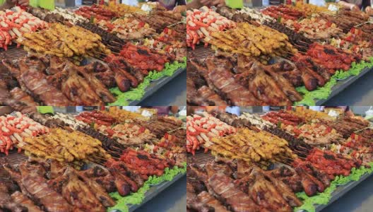 泰国街头小吃:肉串，炸鱼，海鲜夜市，泰国高清在线视频素材下载