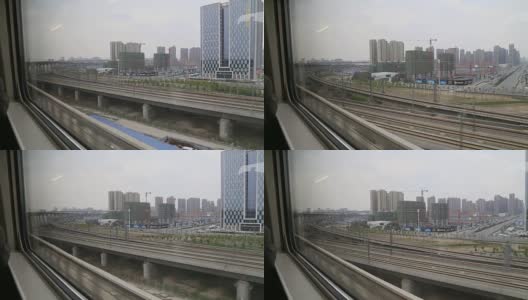 从高铁窗口望着郑州的摩天大楼高清在线视频素材下载