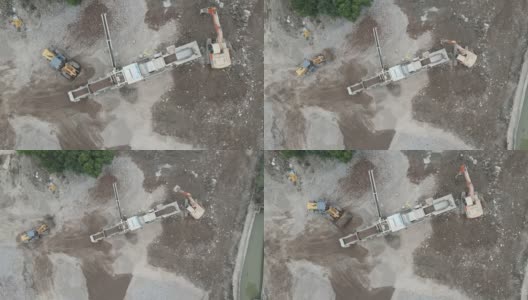 施工现场鸟瞰图，推土机挖掘机制砂机高清在线视频素材下载