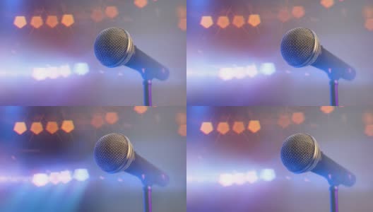 音乐会和闭路音响麦克风在舞台上用五颜六色的聚光灯高清在线视频素材下载