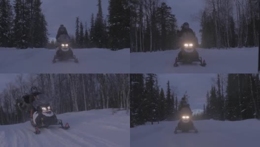雪地车骑手反向追踪镜头高清在线视频素材下载