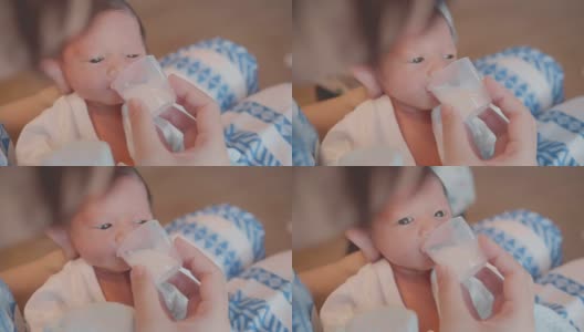 新生儿吃牛奶。高清在线视频素材下载