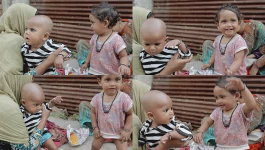 两名印度农村亚裔妇女和她们的孩子高清在线视频素材下载