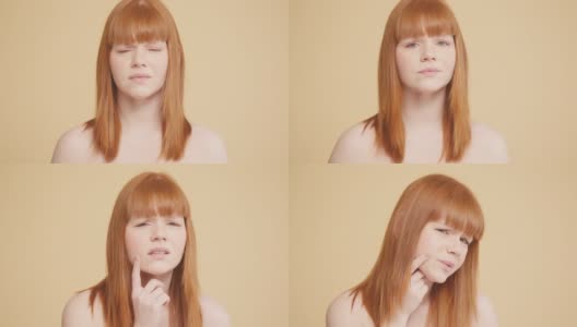 姜黄色头发的年轻女子看着脸上的粉刺高清在线视频素材下载