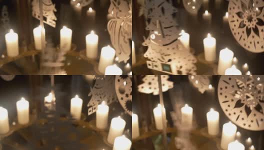 降临节白色蜡烛围绕着胶合板做成的天使或圣诞树装饰高清在线视频素材下载
