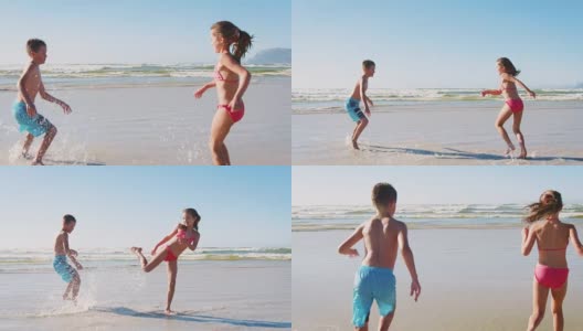 男孩和女孩一起在海滩上玩暑假高清在线视频素材下载