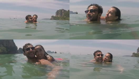 一名男子背着一名女子在海水里游泳高清在线视频素材下载
