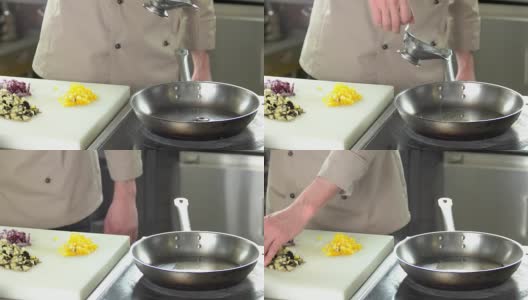 厨师将油倒入锅中。高清在线视频素材下载