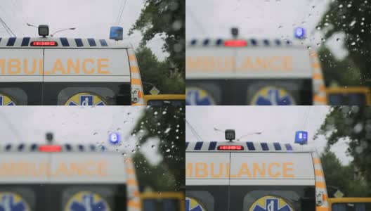 从交通高峰时段的汽车车窗玻璃看救护车堵在路上高清在线视频素材下载