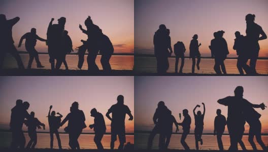日落时分，一群跳舞的年轻人在海滩上举行聚会高清在线视频素材下载
