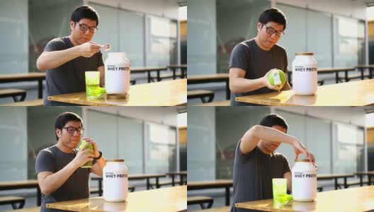 亚洲男人在健身后喝乳清蛋白饮料高清在线视频素材下载