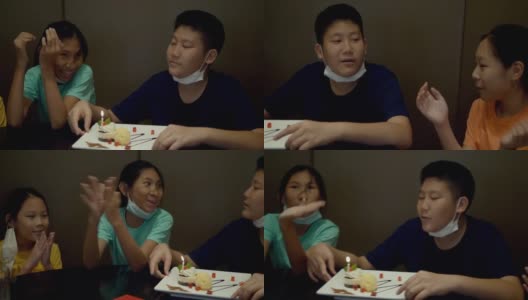 快乐的亚洲孩子们一起在餐厅为他们的兄弟庆祝生日，生活理念。高清在线视频素材下载